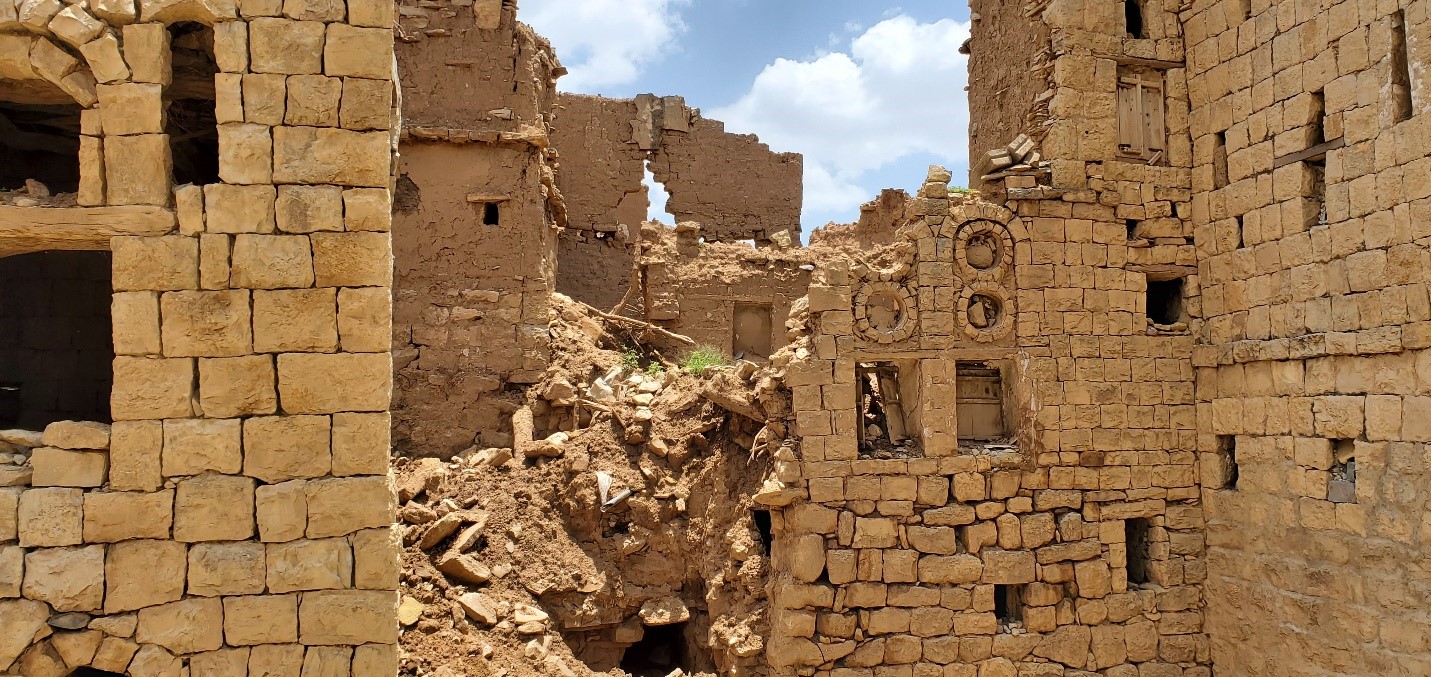 A ruined building with a hole in the wall