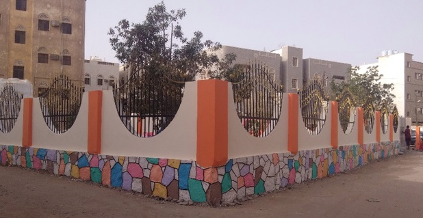A fence with a colorful wall