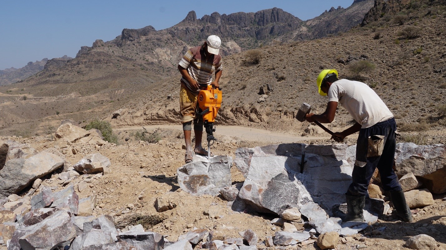Men working on breaking stones