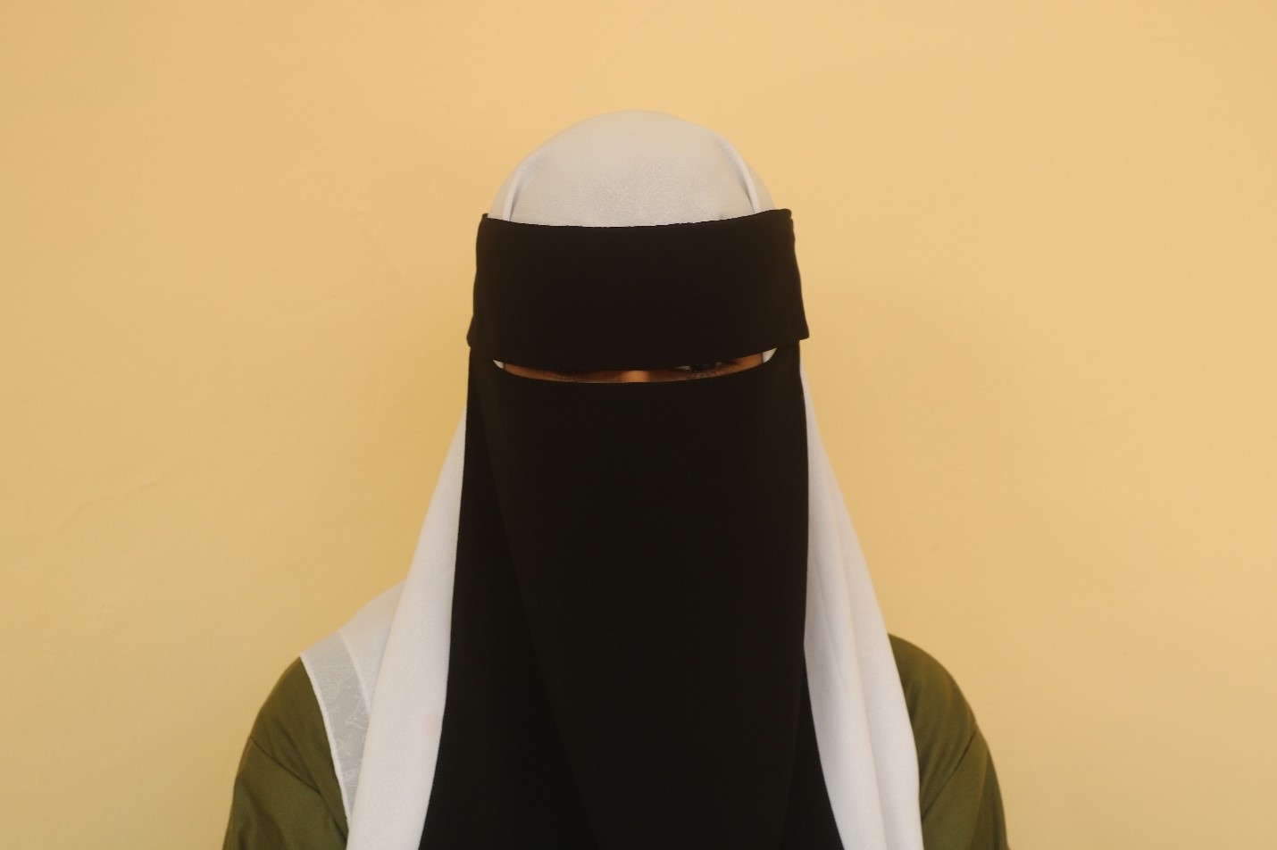 A woman wearing a black and white veil