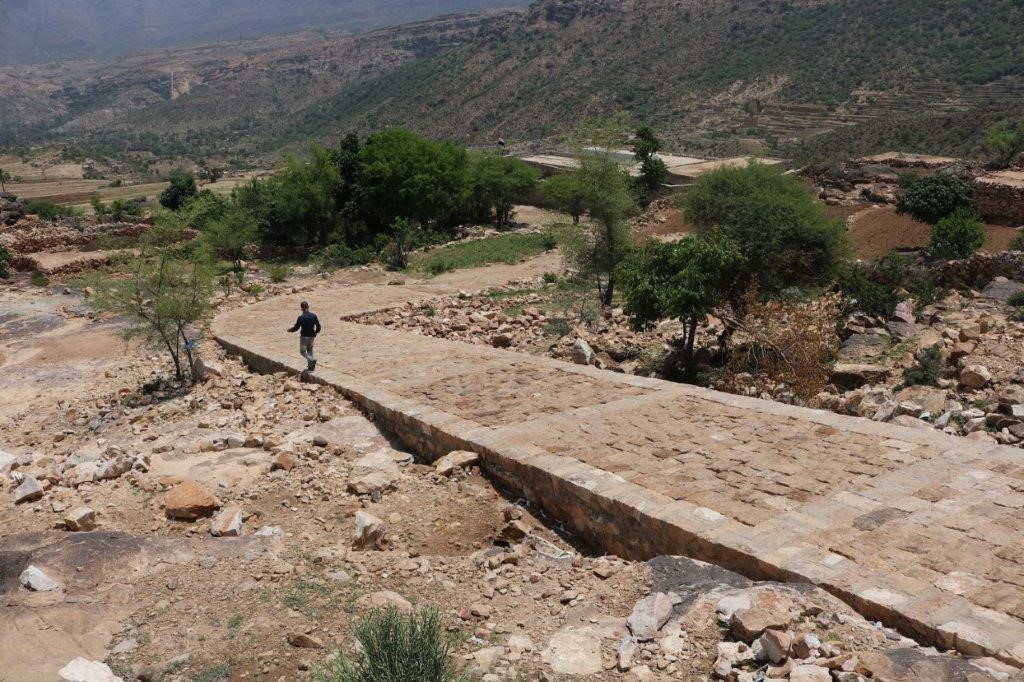 A man walking on a stone path