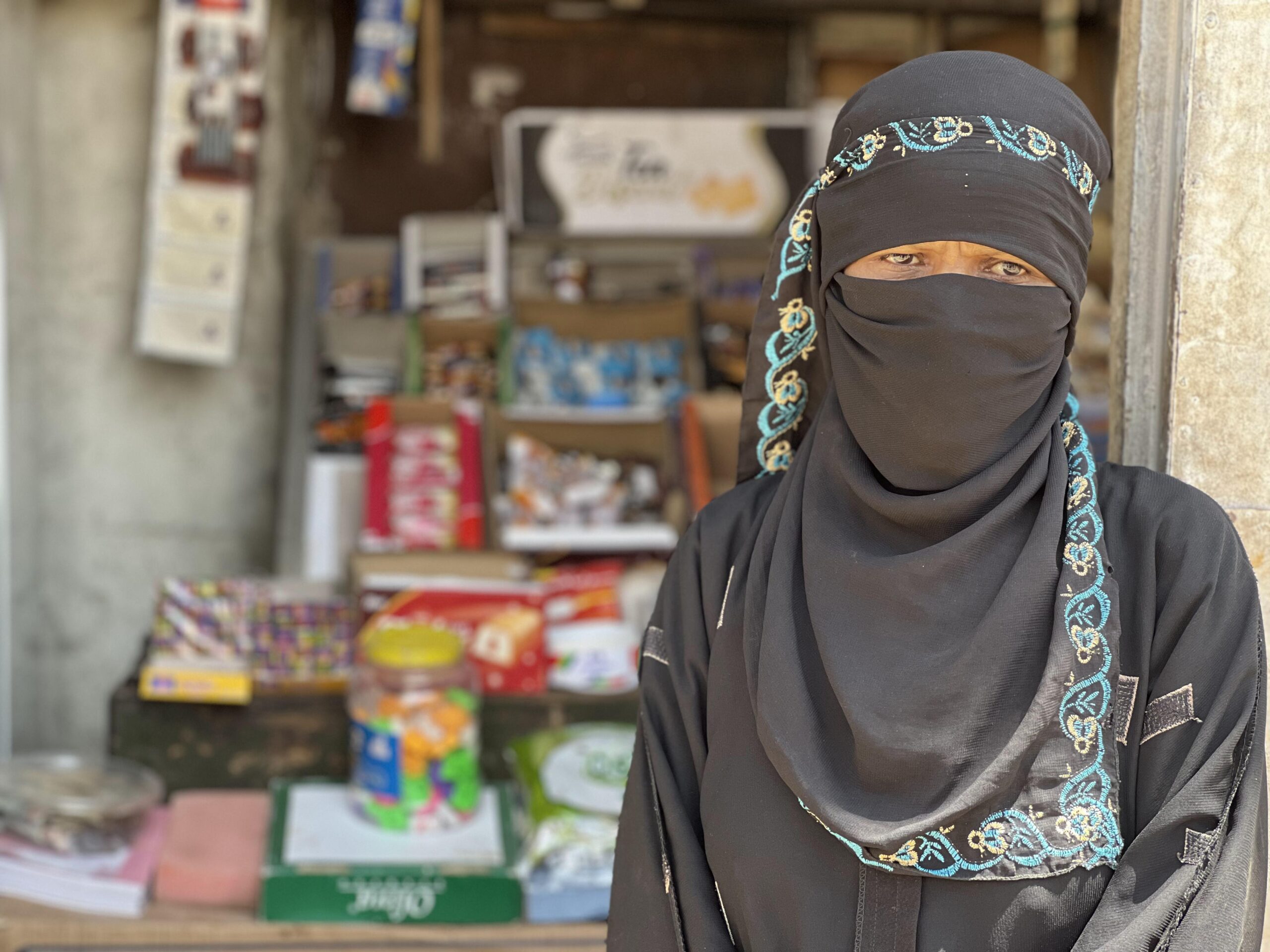 a woman wearing a black head covering