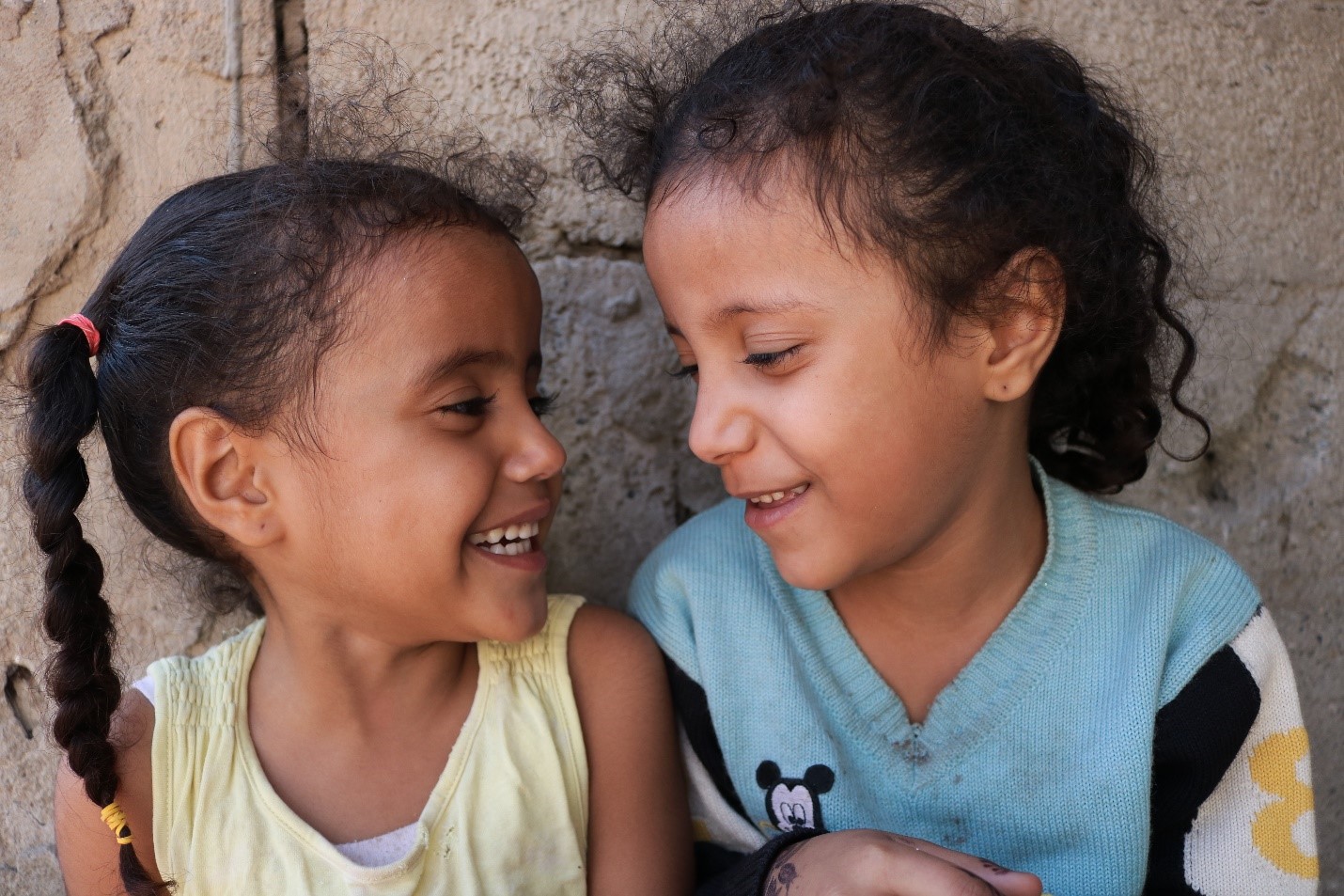 Two young girls smiling