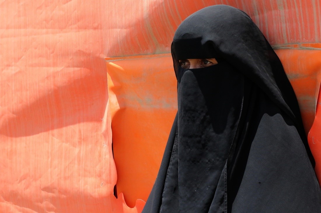 a woman wearing a black burqa