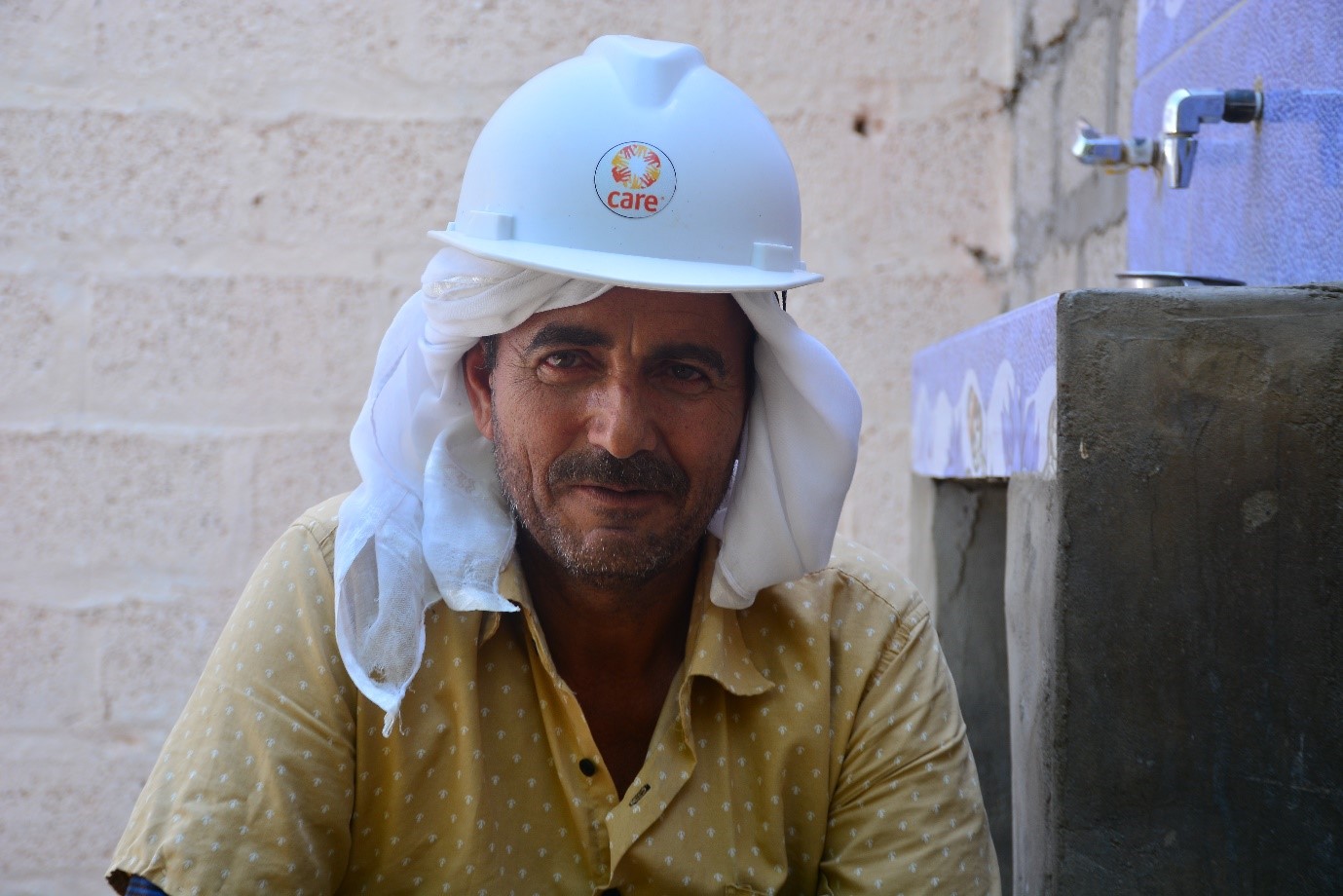 A man wearing a white helmet