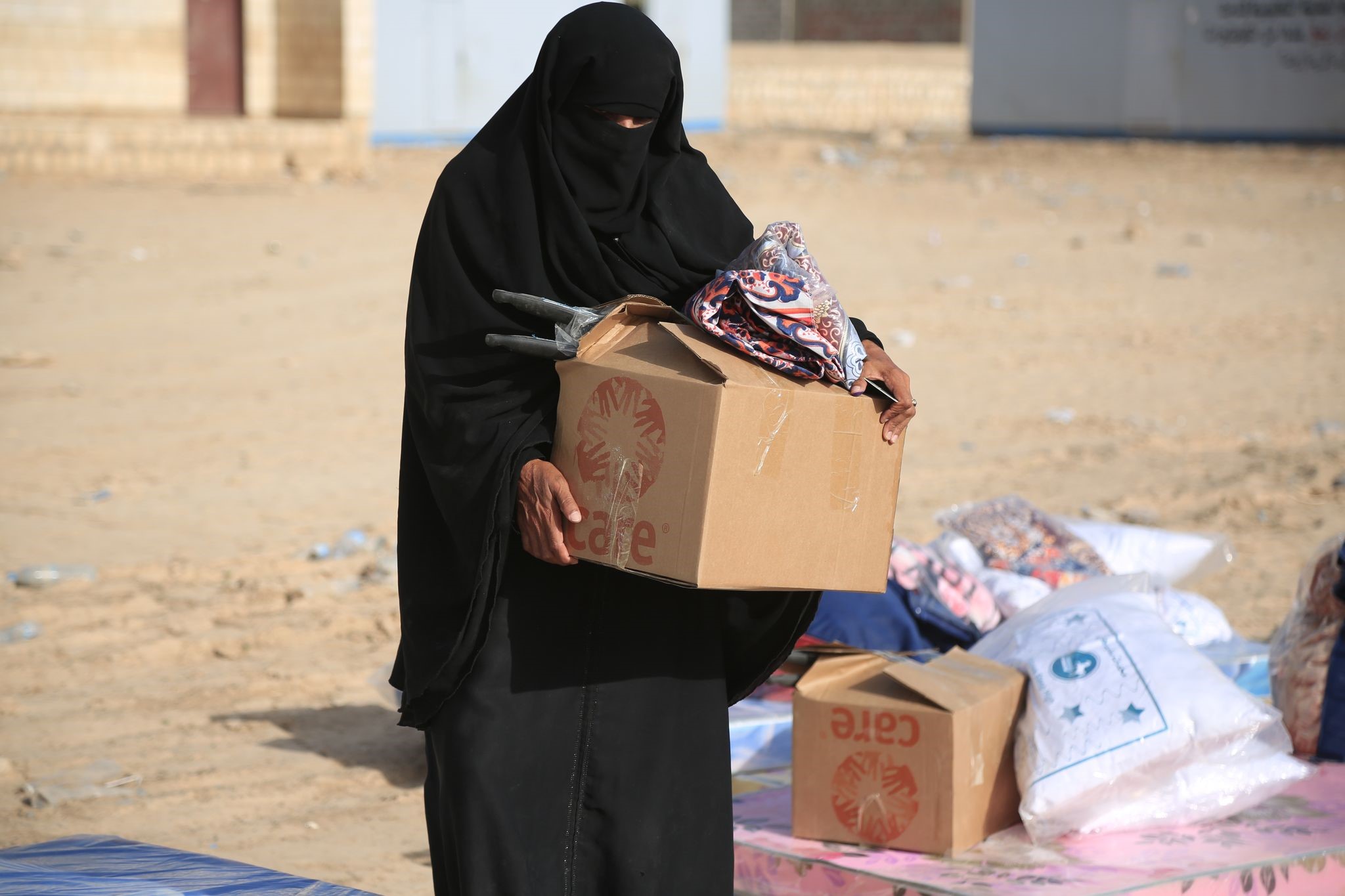 A woman carrying a box